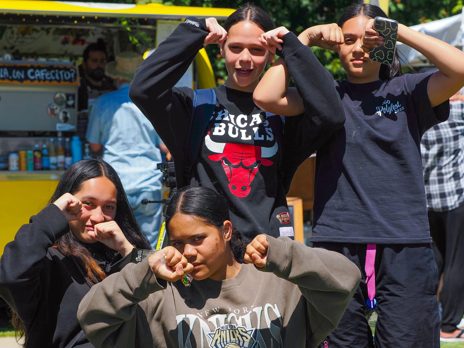 A group of young people having fun at a market stall